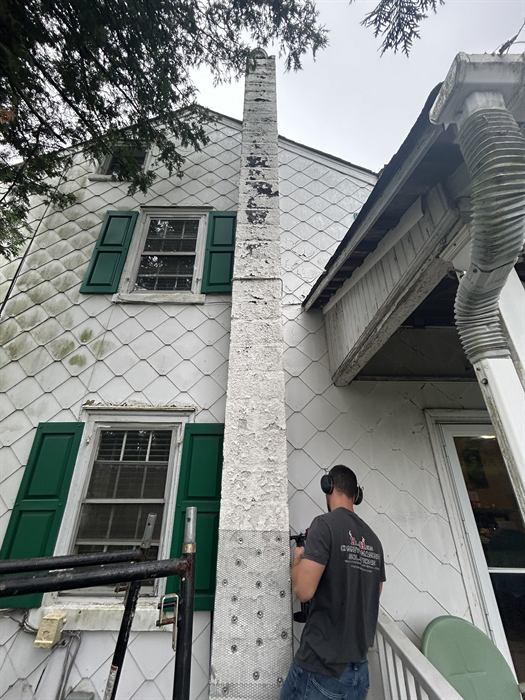 Hughes technician restoring a chimney